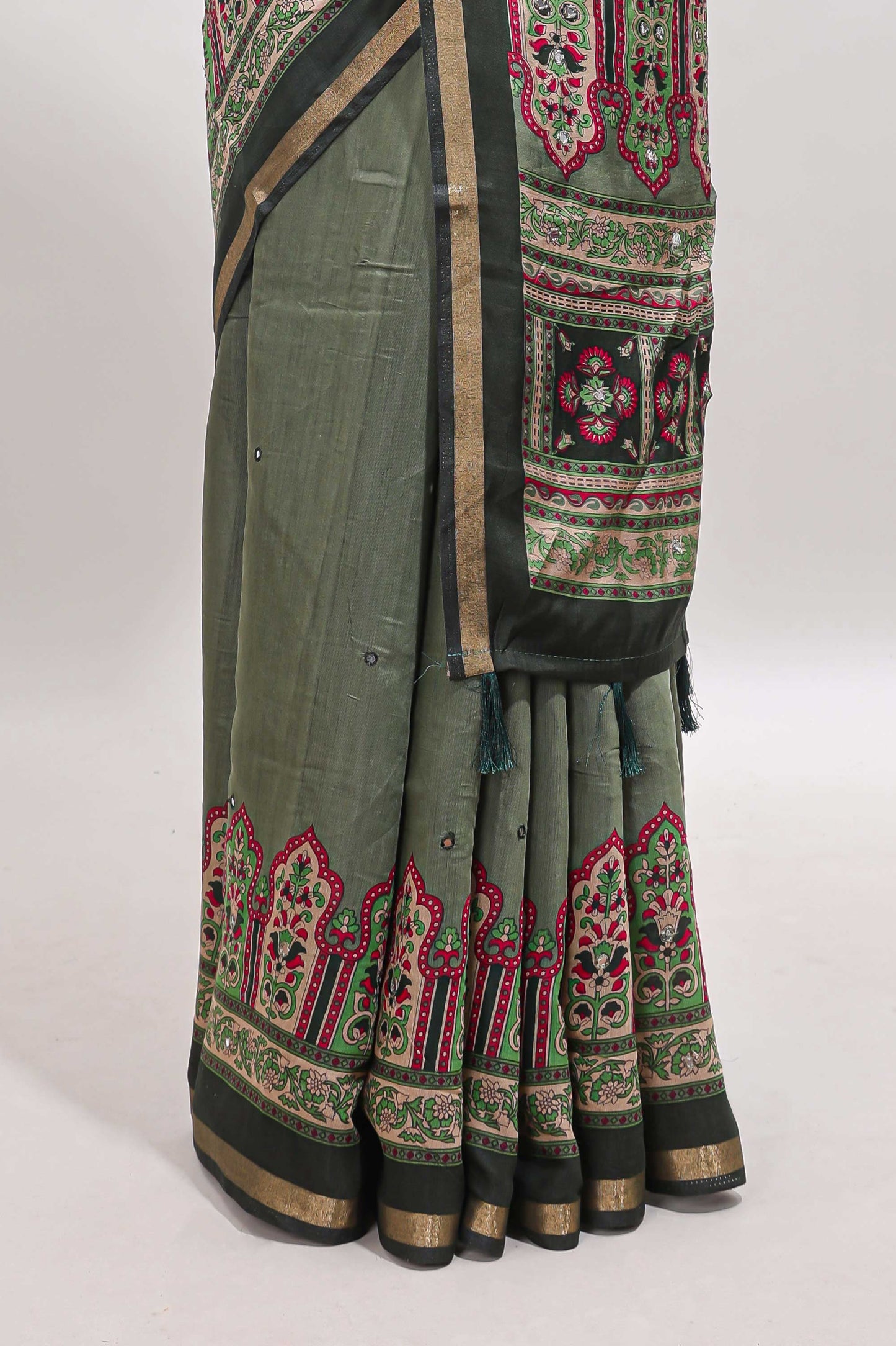 Green printed marsh mellow saree with contrast floral border and tassel pallu