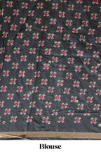 Green printed marsh mellow saree with contrast floral border and tassel pallu