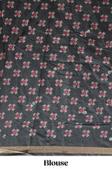 Green printed marsh mellow saree with contrast floral border and tassel pallu
