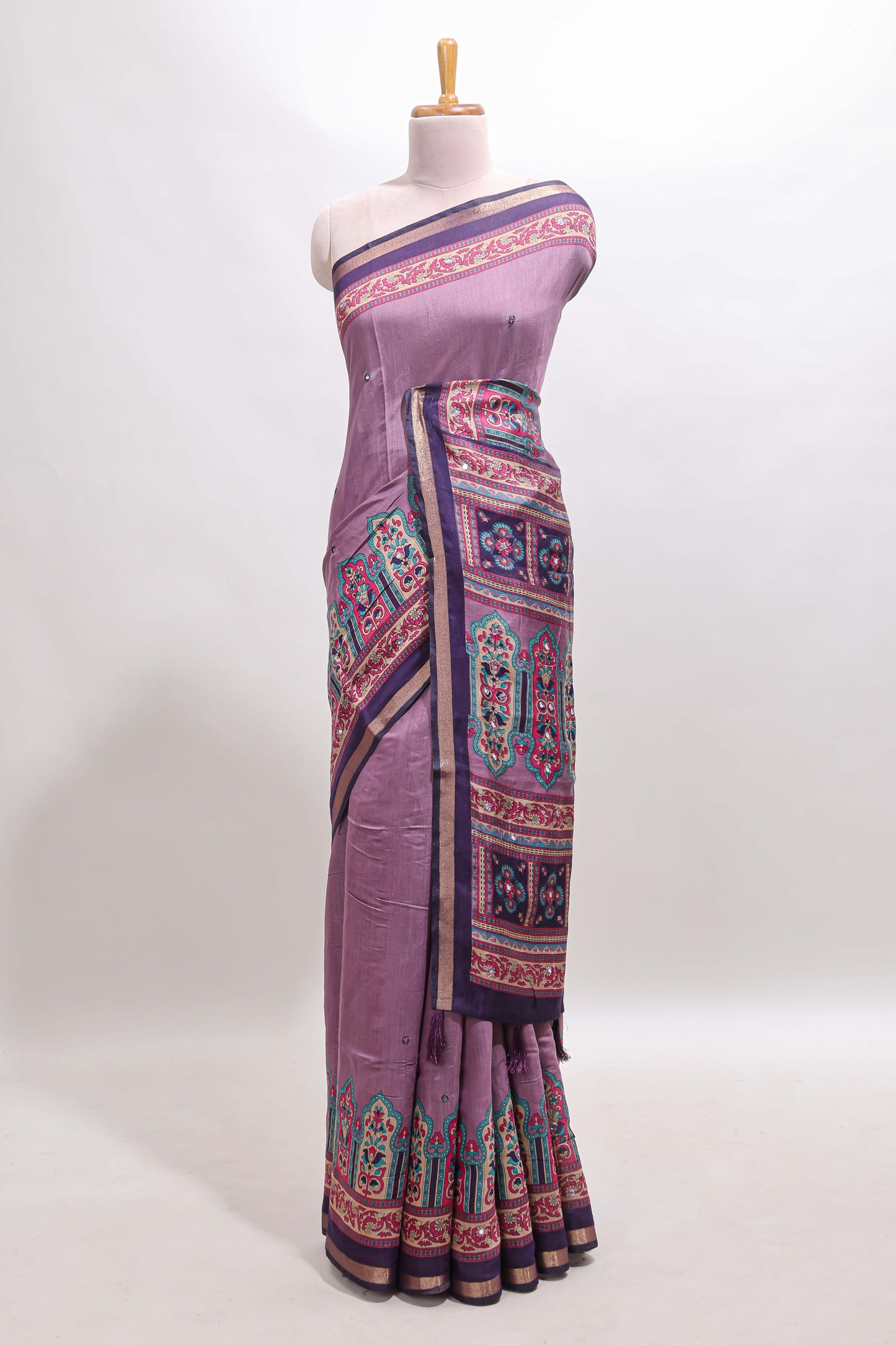 Purple printed marsh mellow saree with contrast floral border and tassel pallu