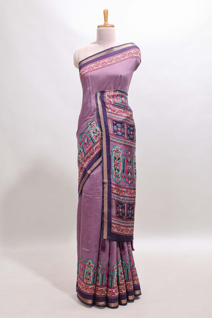 Purple printed marsh mellow saree with contrast floral border and tassel pallu