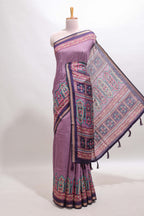 Purple printed marsh mellow saree with contrast floral border and tassel pallu