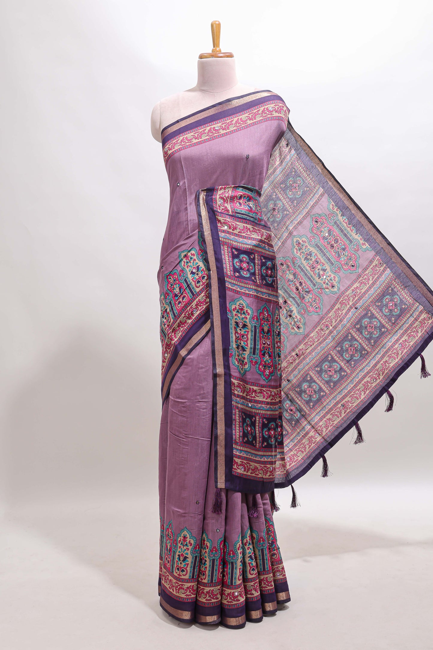 Purple printed marsh mellow saree with contrast floral border and tassel pallu
