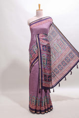Purple printed marsh mellow saree with contrast floral border and tassel pallu