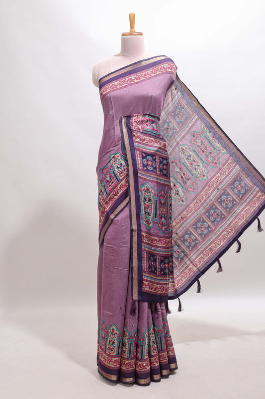 Purple printed marsh mellow saree with contrast floral border and tassel pallu