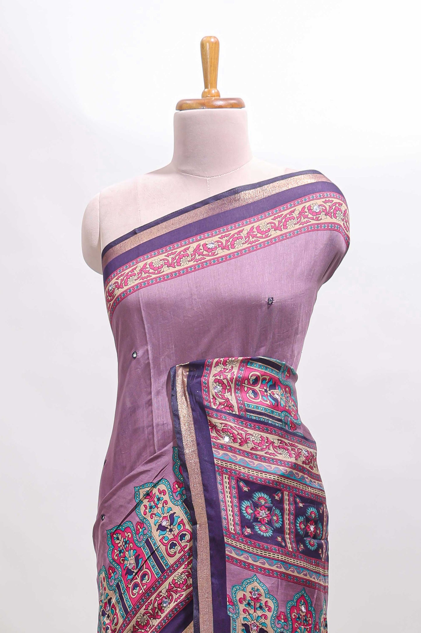 Purple printed marsh mellow saree with contrast floral border and tassel pallu
