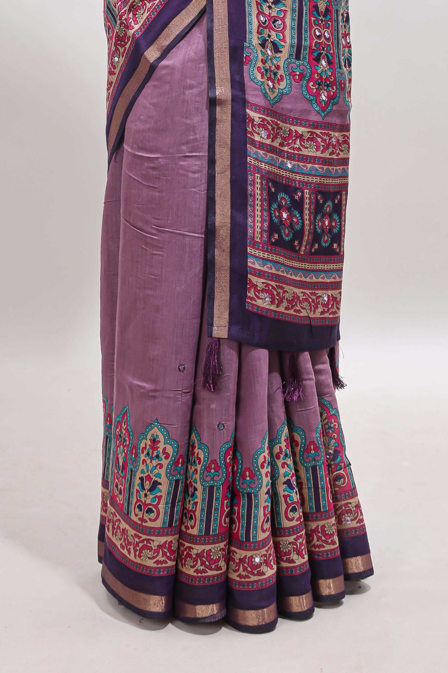 Purple printed marsh mellow saree with contrast floral border and tassel pallu