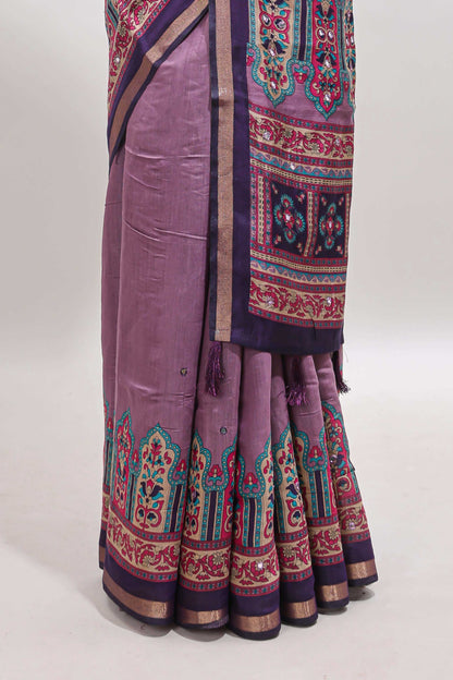 Purple printed marsh mellow saree with contrast floral border and tassel pallu