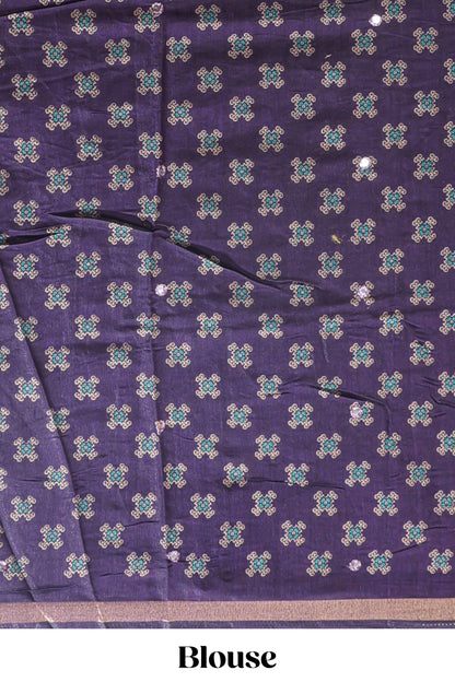 Purple printed marsh mellow saree with contrast floral border and tassel pallu