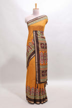 Mustard printed marsh mellow saree with contrast floral border and tassel pallu