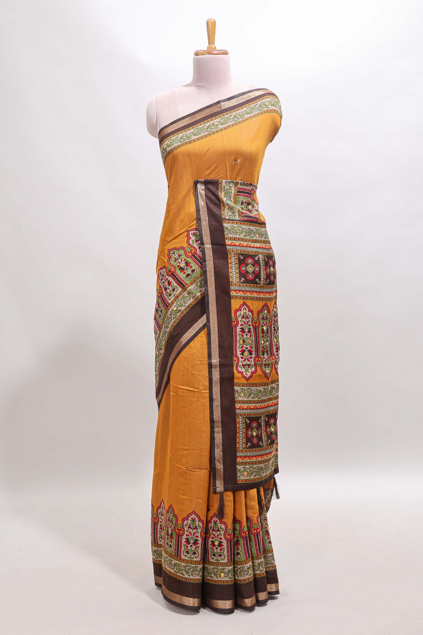 Mustard printed marsh mellow saree with contrast floral border and tassel pallu