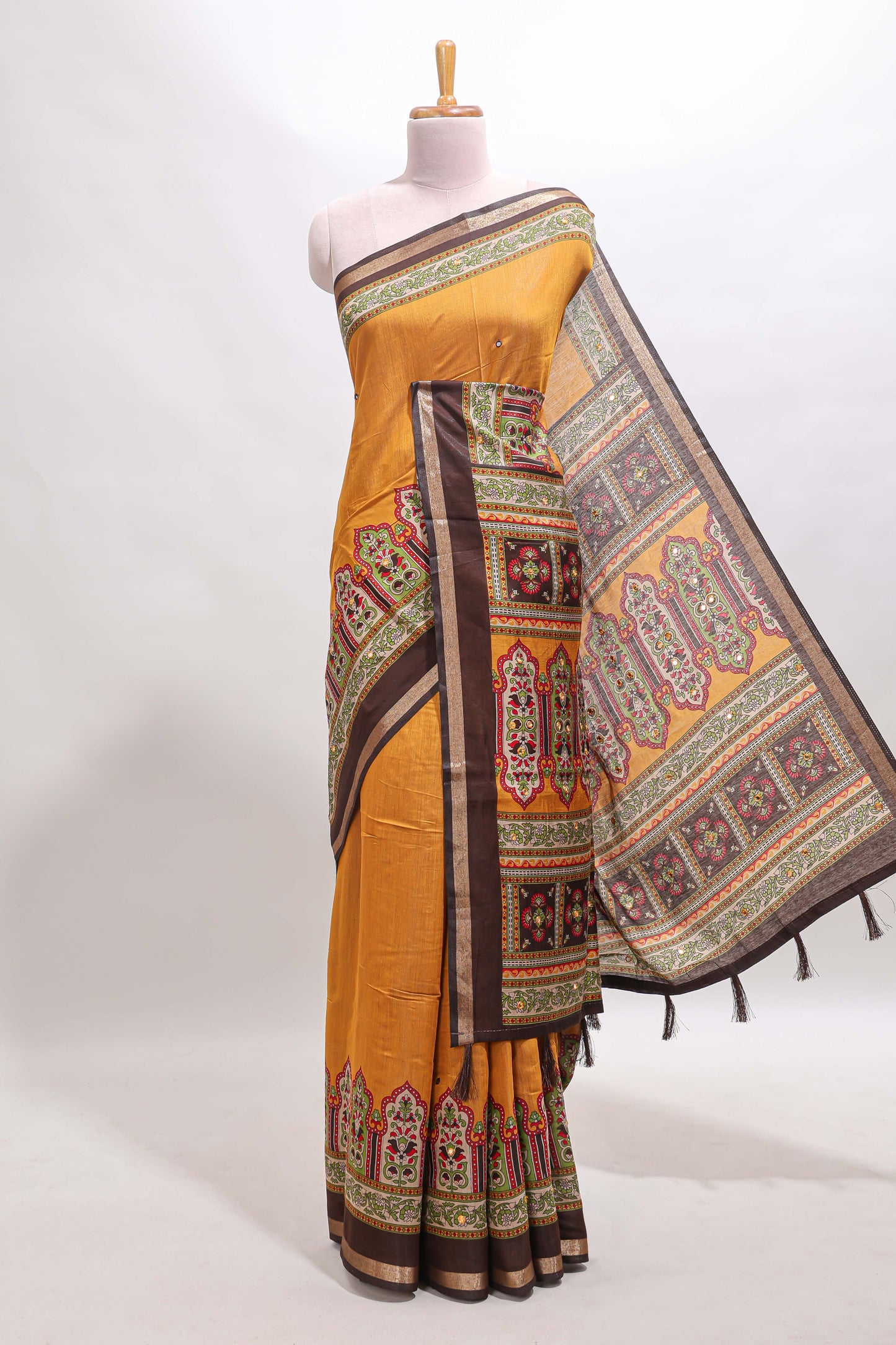Mustard printed marsh mellow saree with contrast floral border and tassel pallu