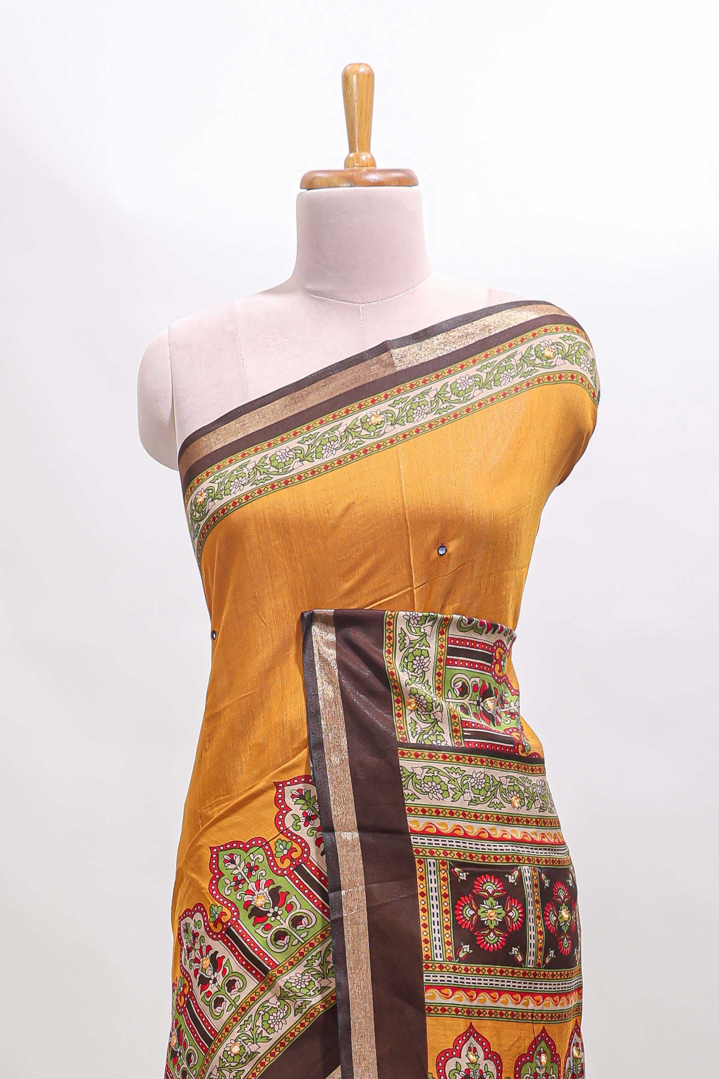 Mustard printed marsh mellow saree with contrast floral border and tassel pallu