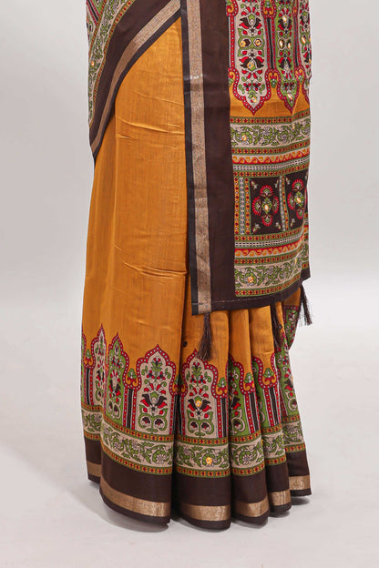 Mustard printed marsh mellow saree with contrast floral border and tassel pallu