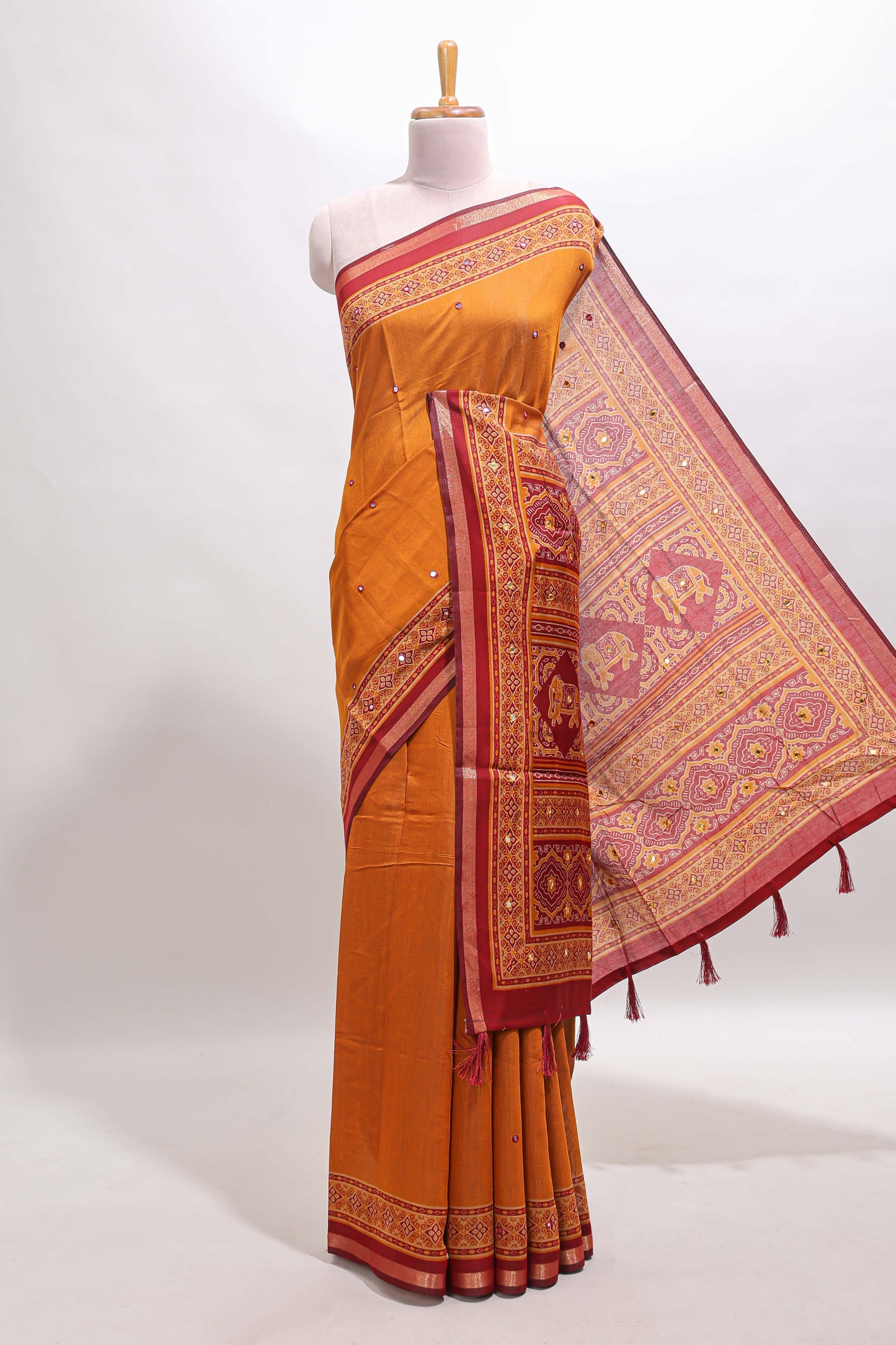 Mustard embroidery mirror work marsh mellow saree with contrast border and printed blouse