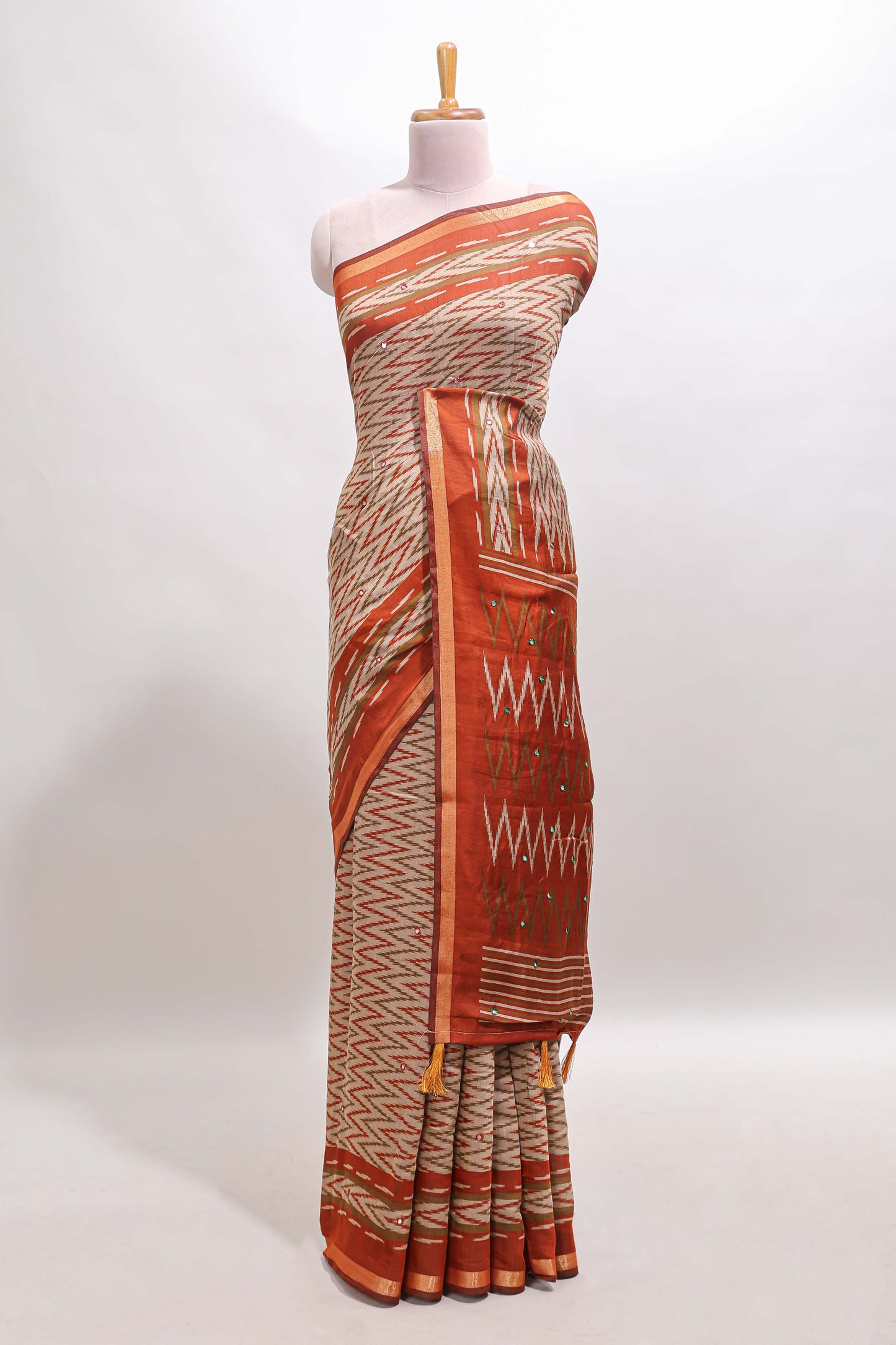 Beige chevron embroidery mirror work marsh mellow saree with contrast orange border and printed blouse
