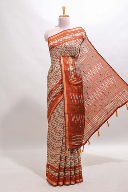 Beige chevron embroidery mirror work marsh mellow saree with contrast orange border and printed blouse