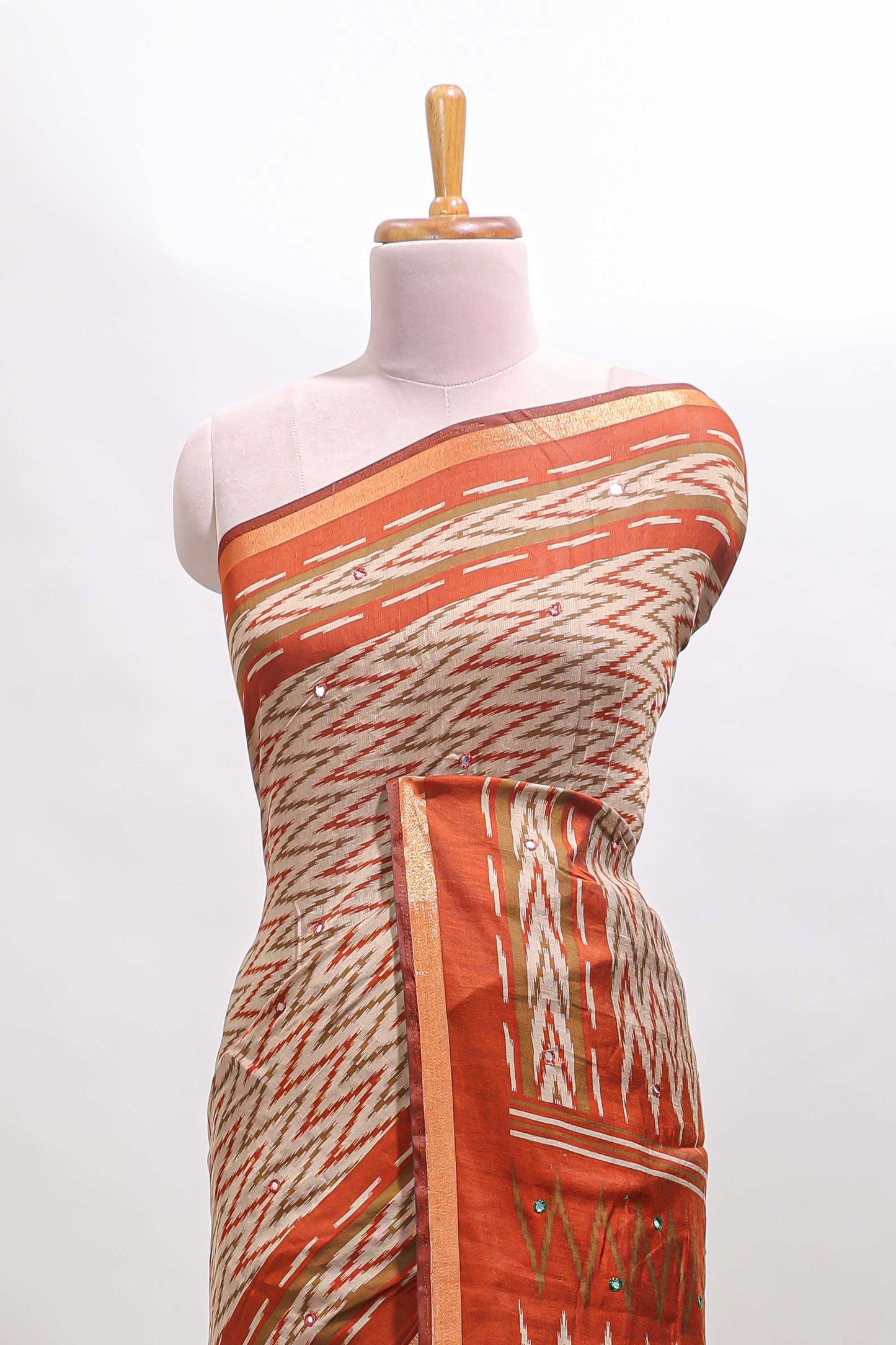 Beige chevron embroidery mirror work marsh mellow saree with contrast orange border and printed blouse