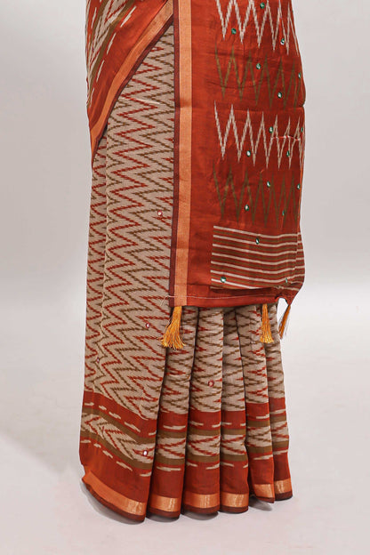 Beige chevron embroidery mirror work marsh mellow saree with contrast orange border and printed blouse