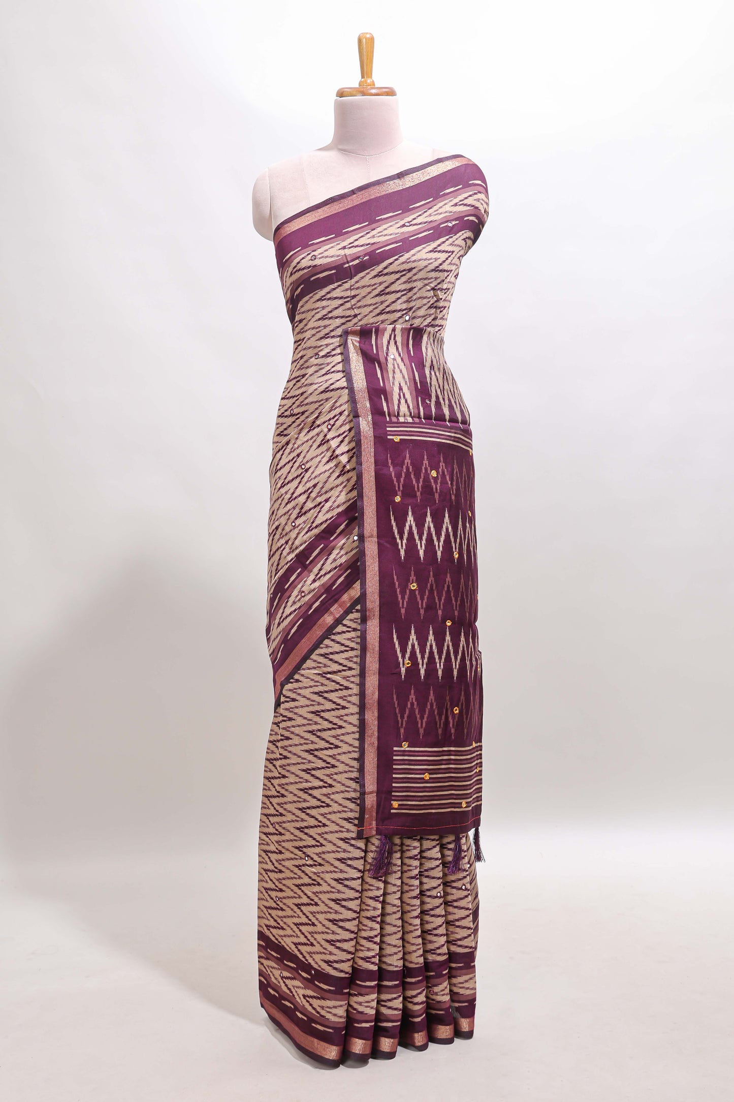 Beige chevron embroidery mirror work marsh mellow saree with contrast purple border and printed blouse