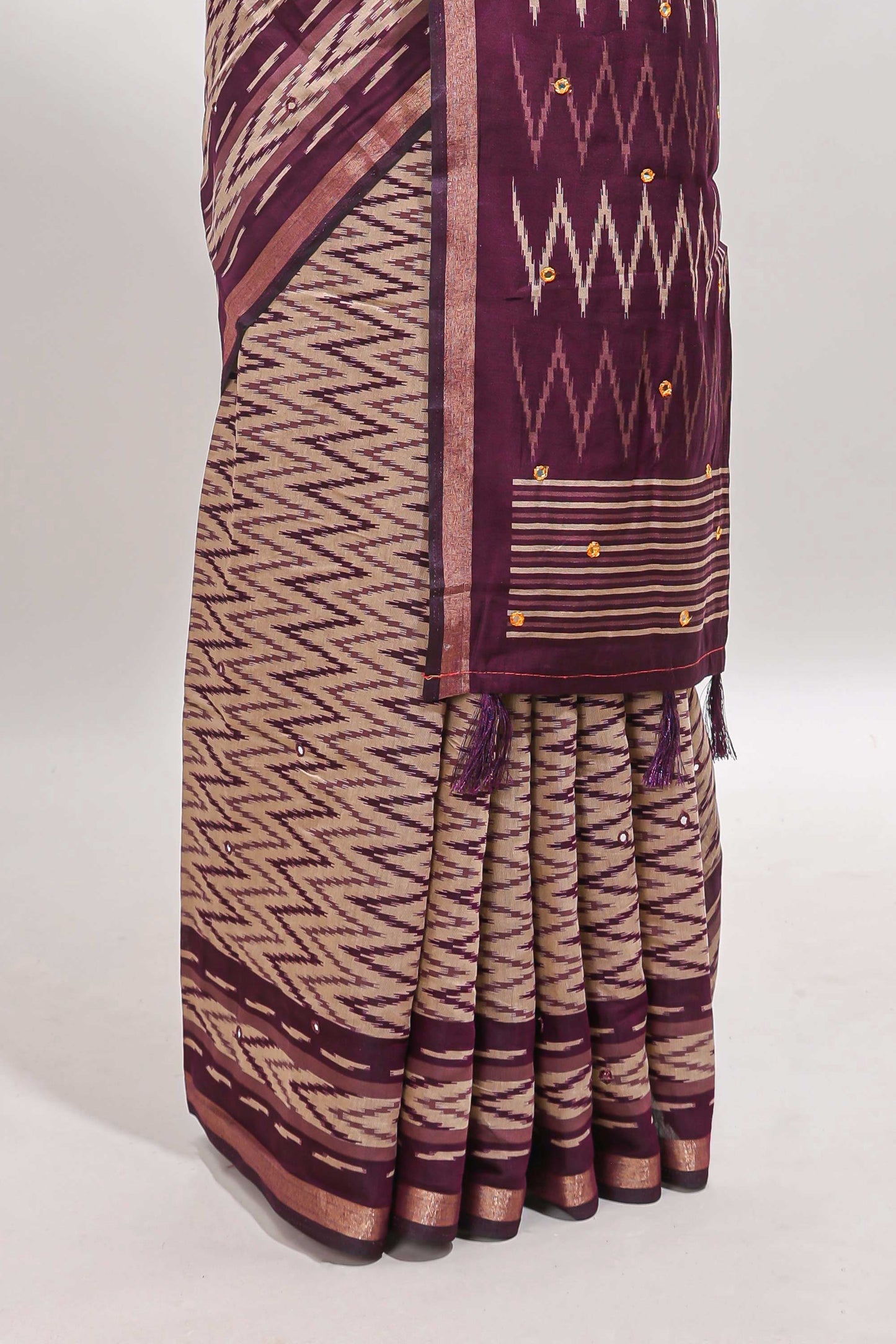Beige chevron embroidery mirror work marsh mellow saree with contrast purple border and printed blouse