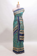 Peacock blue floral motifs design marsh mellow saree with contrast border and printed blouse