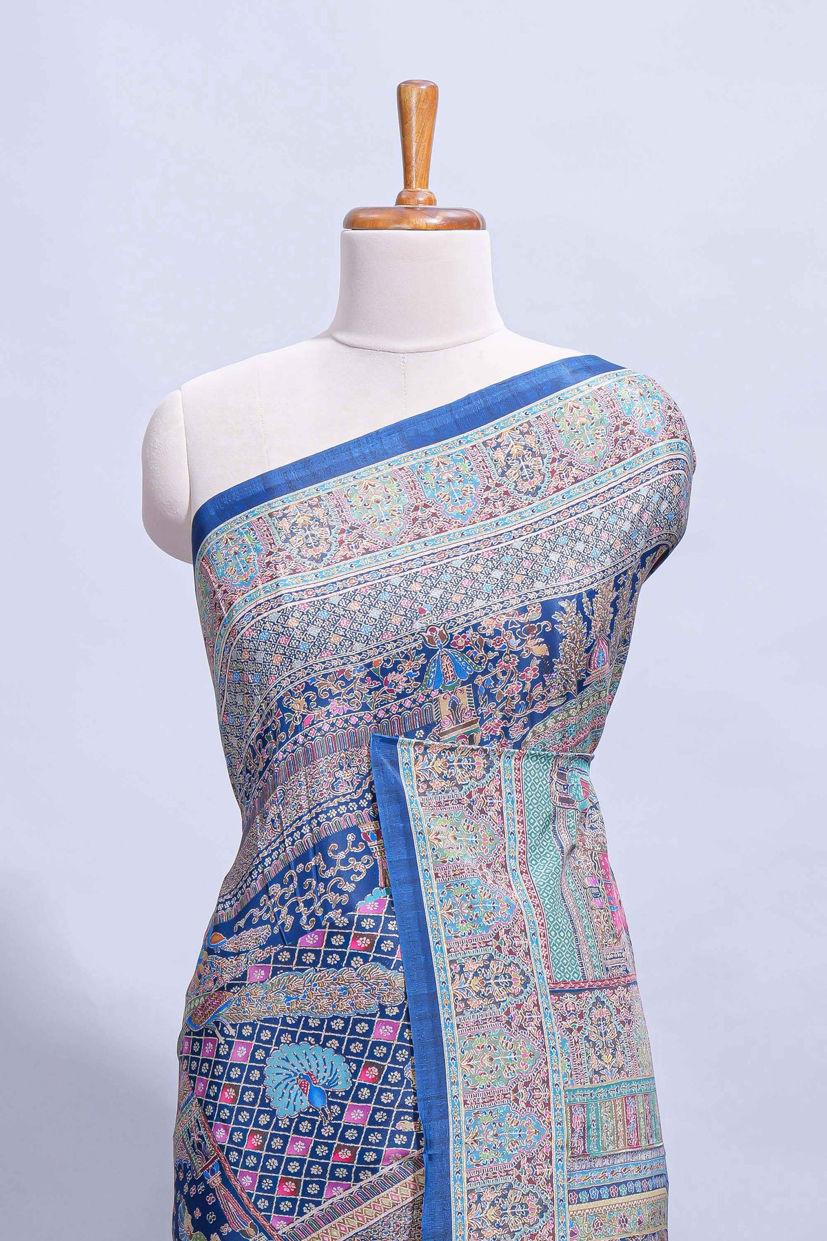 Royal blue mughal printed marsh mellow saree with self border and self printed pallu along with matching blouse