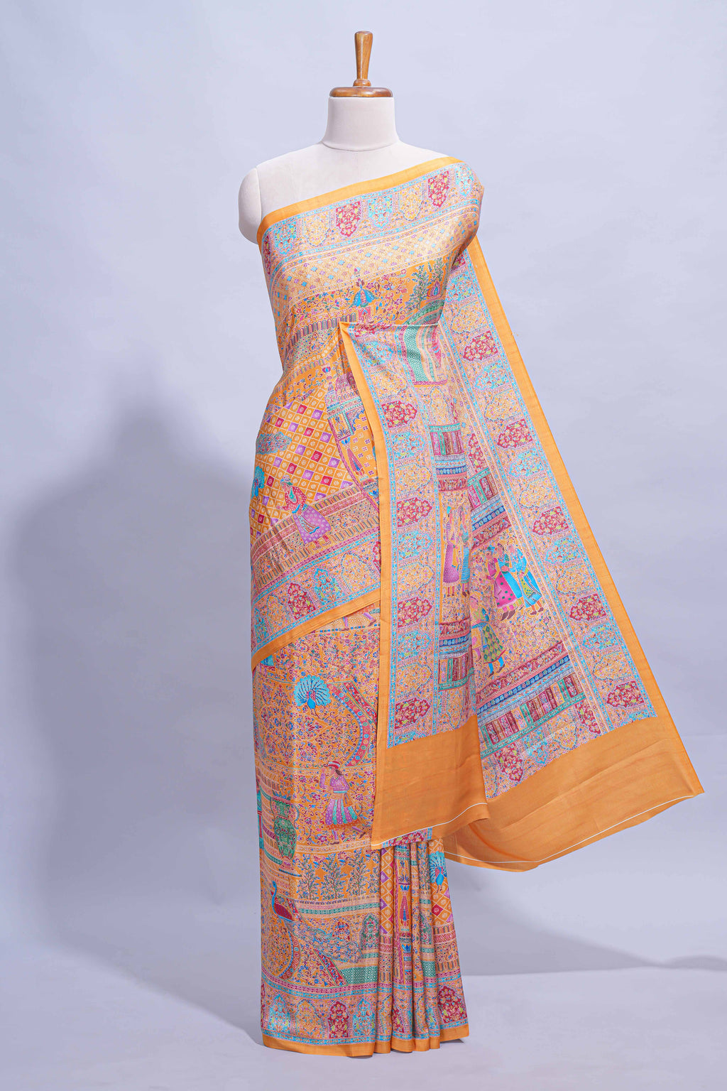 Orange colour mughal printed marsh mellow saree with self border and self printed pallu along with matching blouse