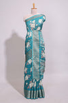 Teal green checked floral design marsh mellow saree with self zari border and matching blouse