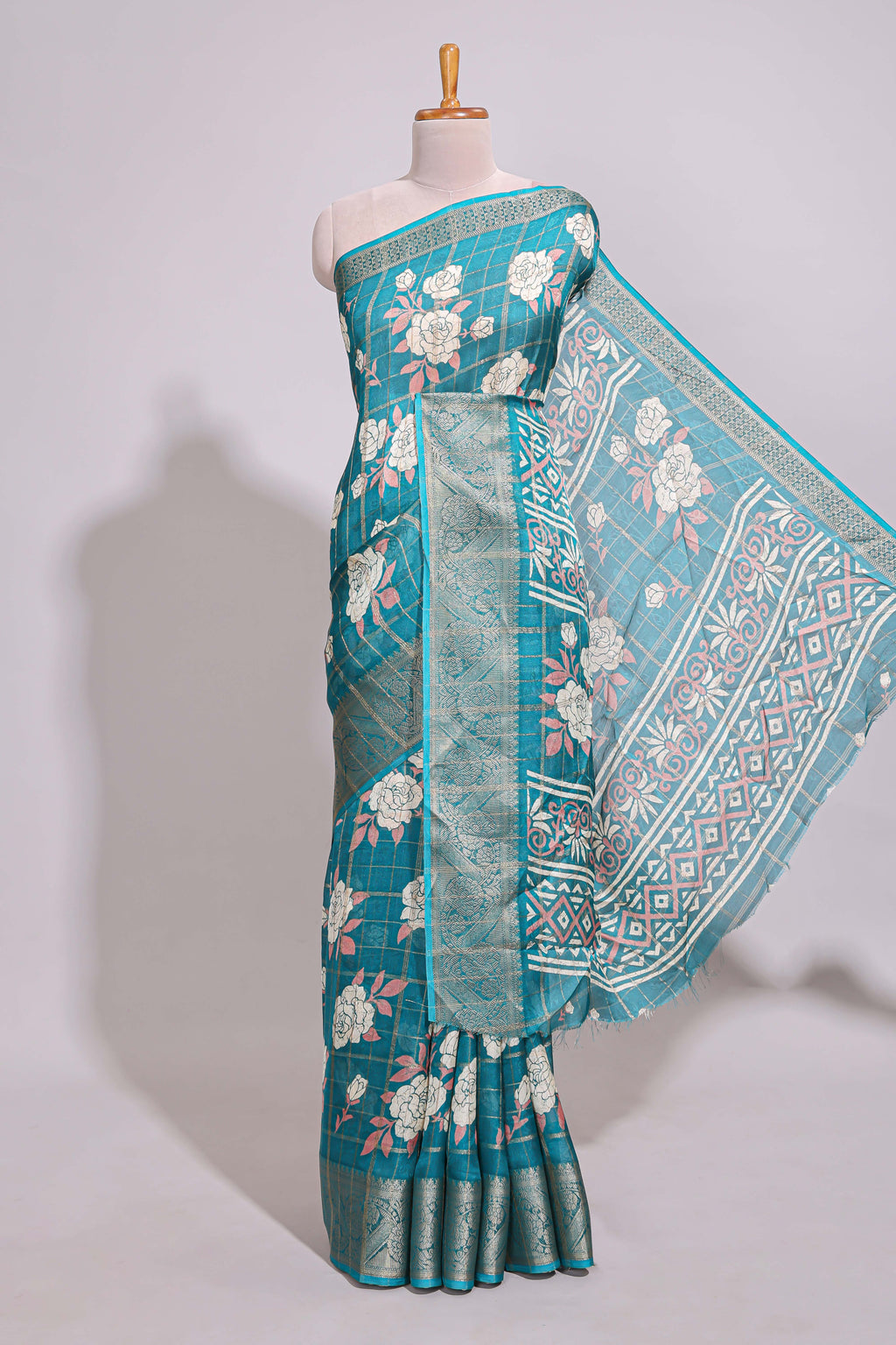 Teal green checked floral design marsh mellow saree with self zari border and matching blouse