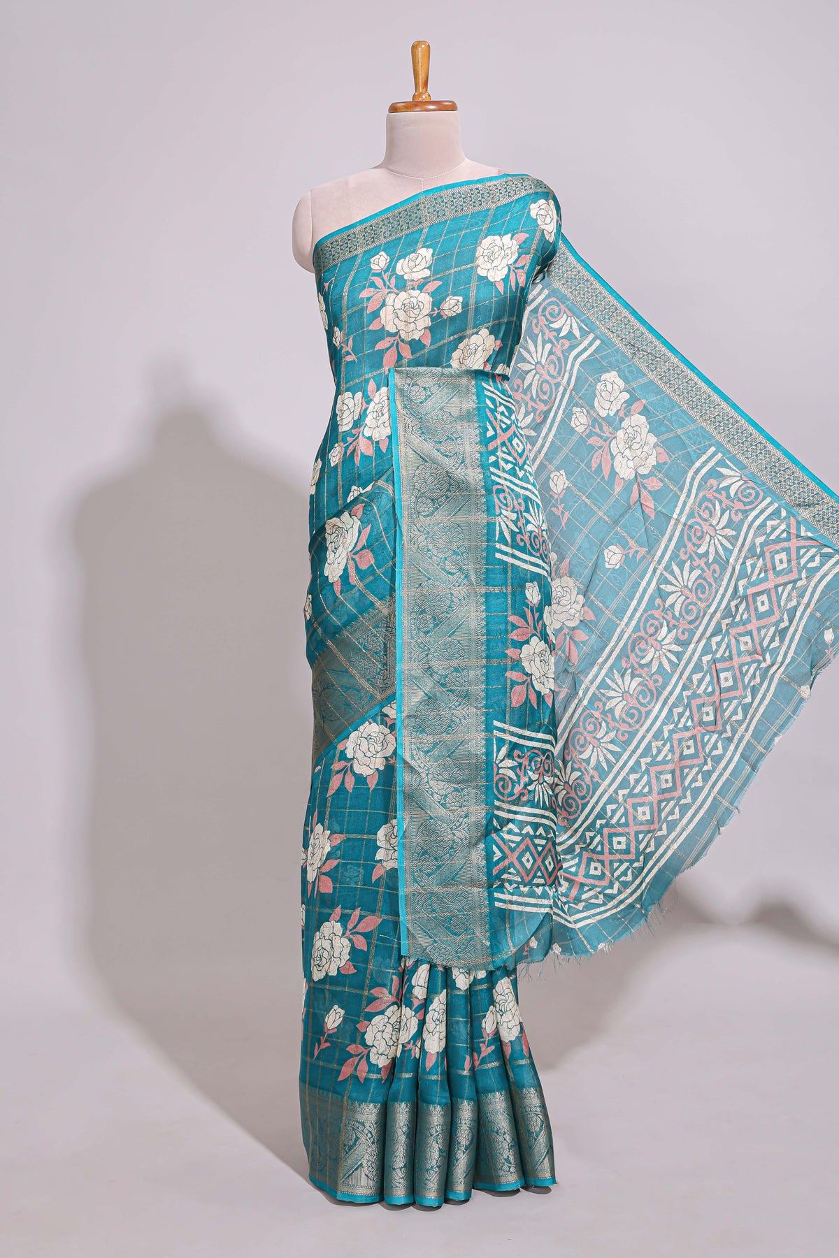 Teal green checked floral design marsh mellow saree with self zari border and matching blouse