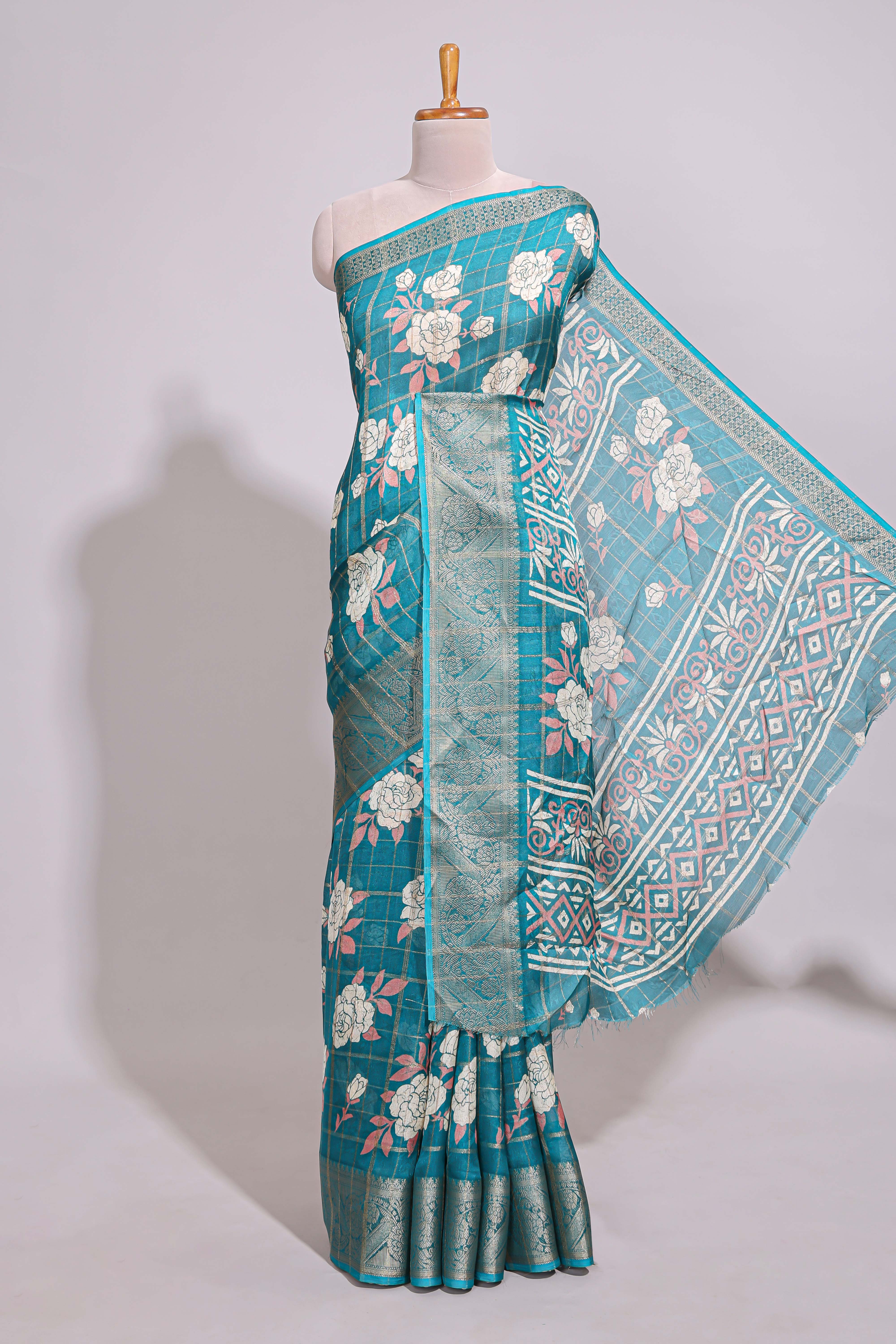 Teal green checked floral design marsh mellow saree with self zari border and matching blouse