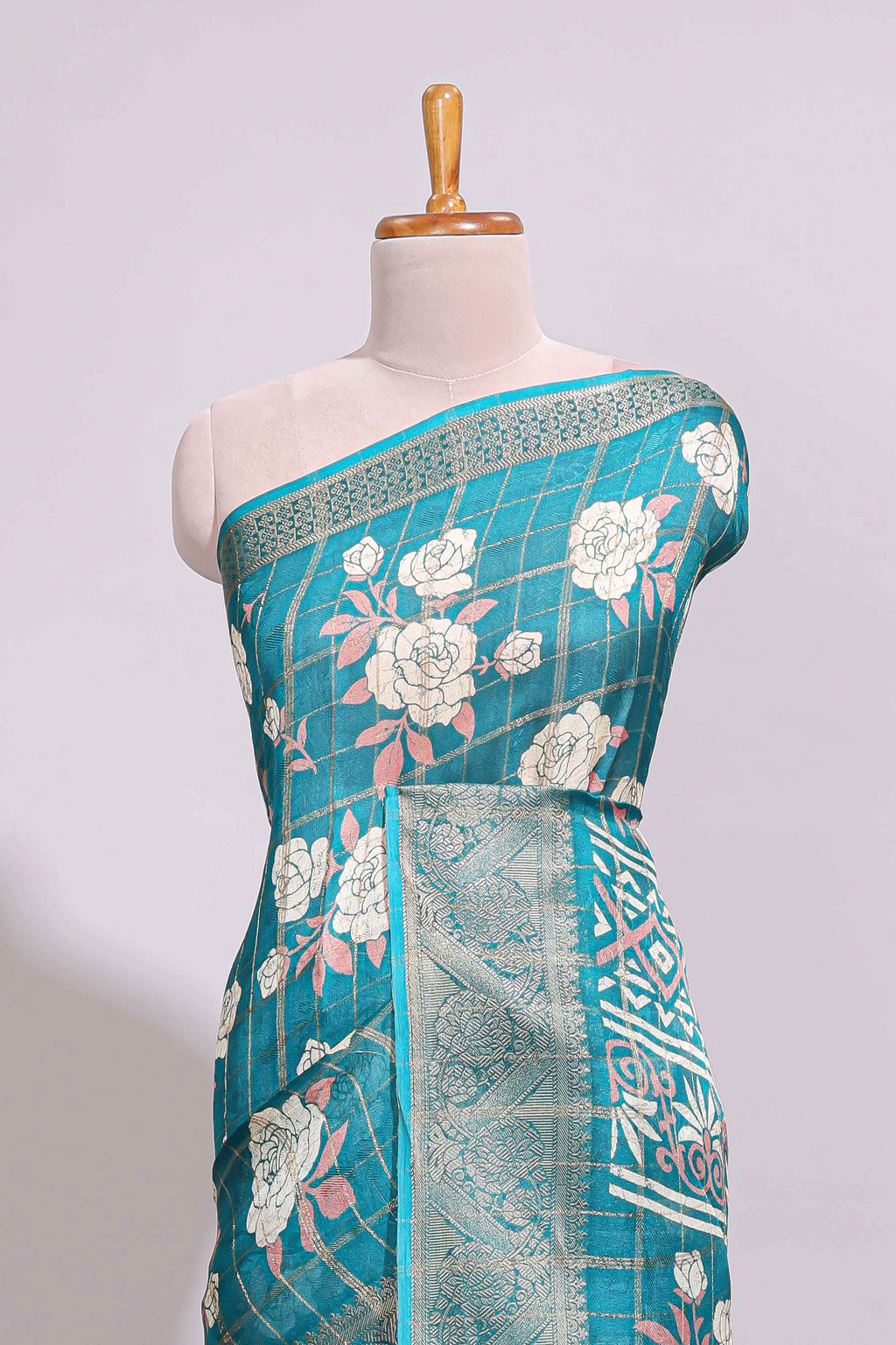 Teal green checked floral design marsh mellow saree with self zari border and matching blouse