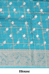 Teal green checked floral design marsh mellow saree with self zari border and matching blouse