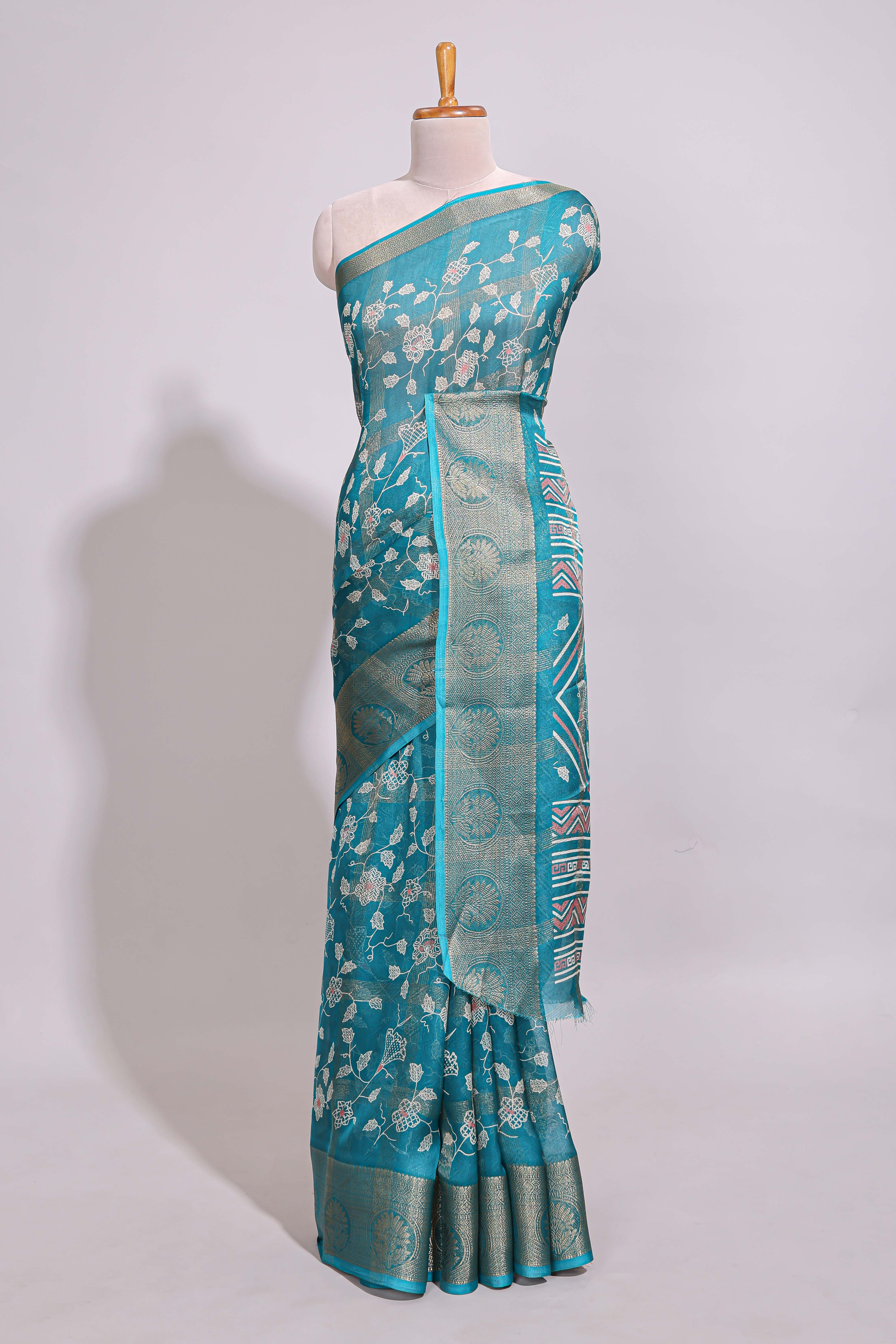 Teal green checked floral design marsh mellow saree with self zari border and matching zari blouse