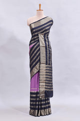 Lavender zari design mushru silk saree with contrast striped zari border and blouse