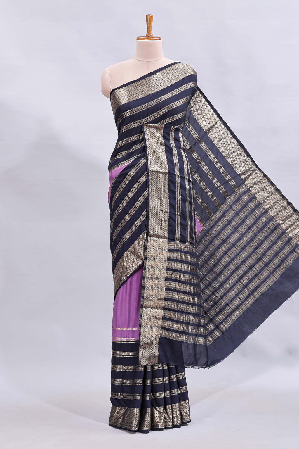 Lavender zari design mushru silk saree with contrast striped zari border and blouse