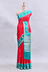 Red zari motifs design mushru silk saree with contrast border and zari blouse