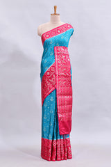 Blue floral design mushru silk saree with contrast border and zari blouse