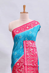 Blue floral design mushru silk saree with contrast border and zari blouse