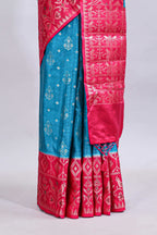 Blue floral design mushru silk saree with contrast border and zari blouse
