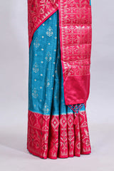 Blue floral design mushru silk saree with contrast border and zari blouse