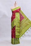 Maroon floral design mushru silk saree with contrast border and zari blouse