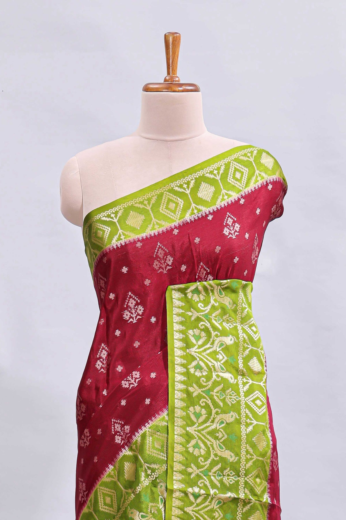 Maroon floral design mushru silk saree with contrast border and zari blouse