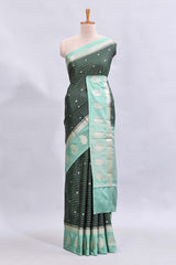 Green checked floral motifs design mushru silk saree with contrast border and blouse