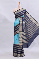 Blue zari design mushru silk saree with contrast striped zari border and blouse