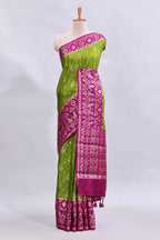 Green floral design mushru silk saree with contrast border and zari blouse