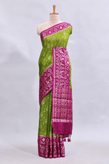 Green floral design mushru silk saree with contrast border and zari blouse
