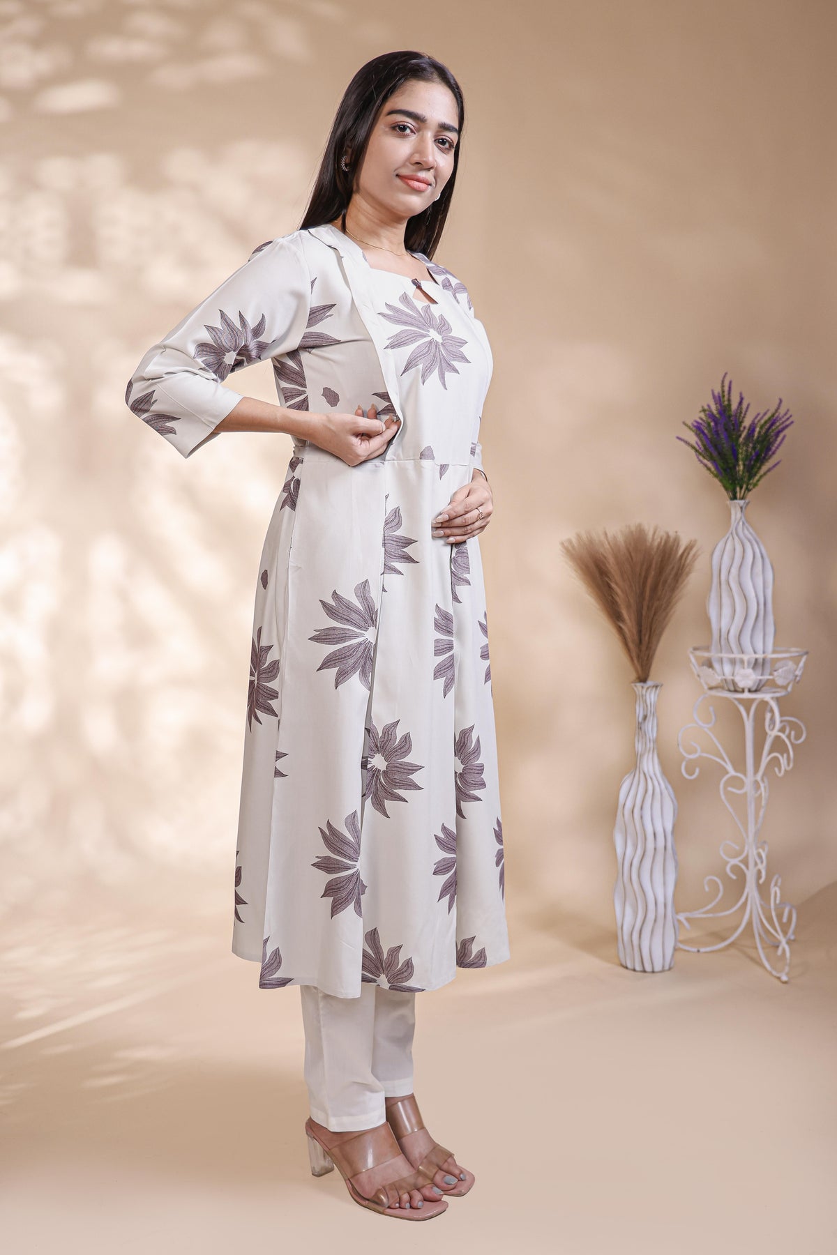 White floral printed A-line maternity wear with 3/4 sleeves and keyhole neck