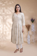 Off White floral printed A-line maternity wear with 3/4 sleeves and keyhole neck